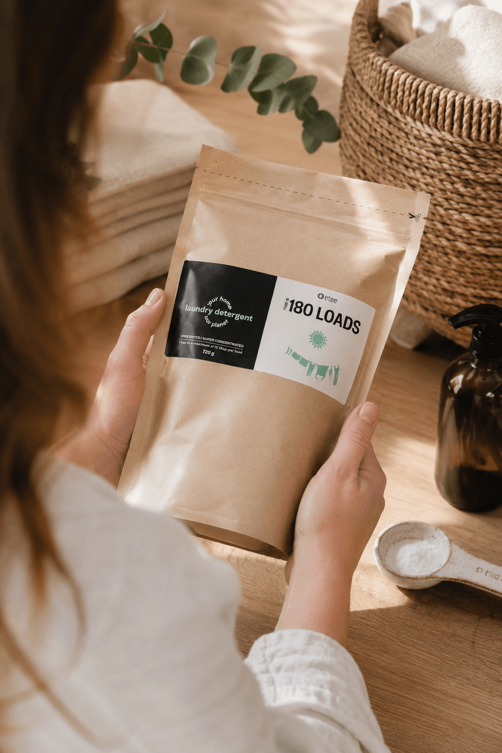 Shop Etee kraft pouch product held in hand