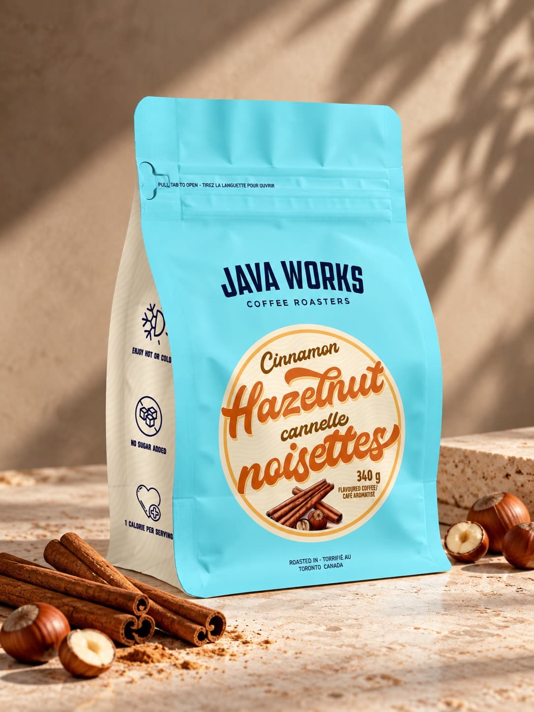 Java Works Cinnamon Hazelnut coffee pouch styled with cinnamon and hazelnuts